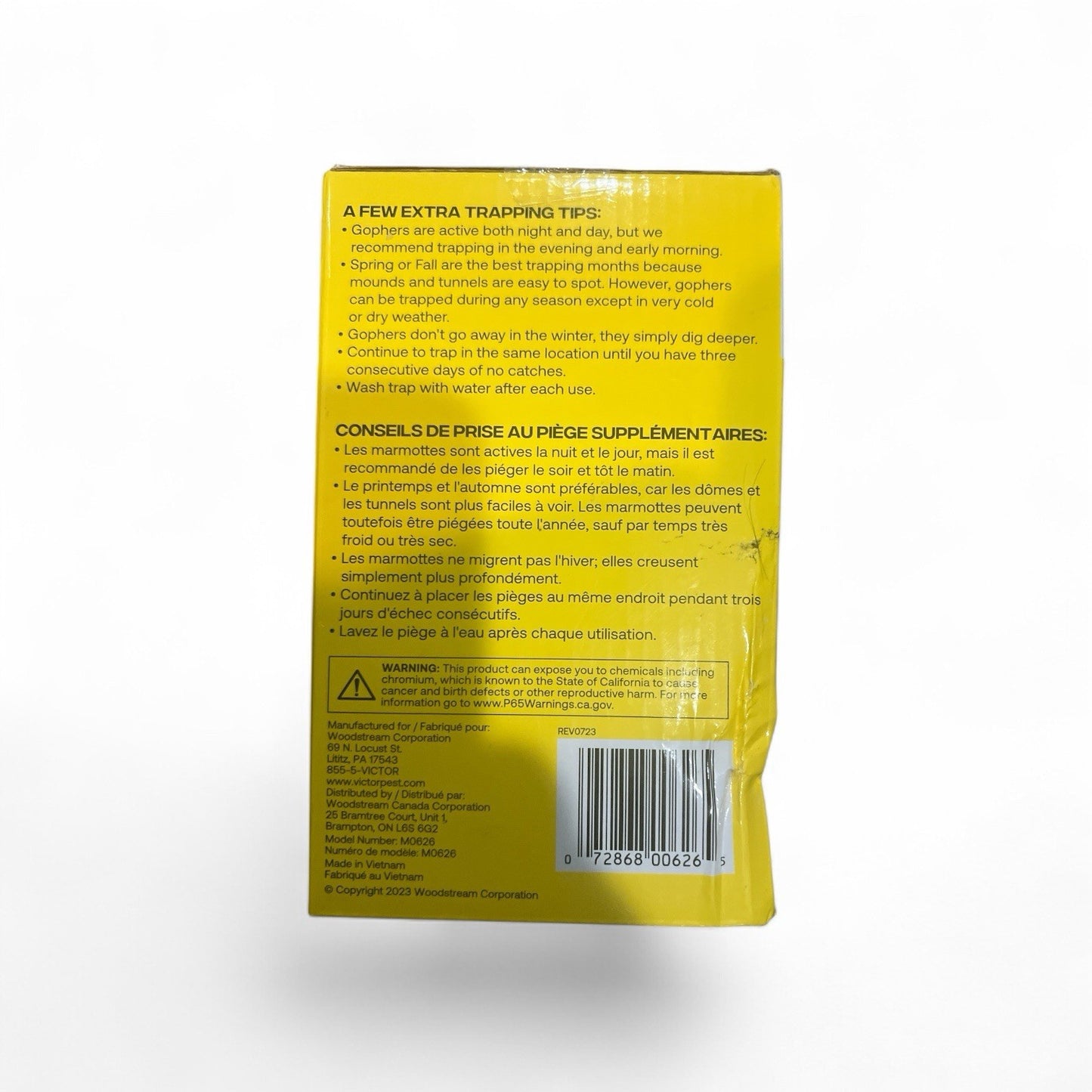 Yellow package with text and a barcode on a white background